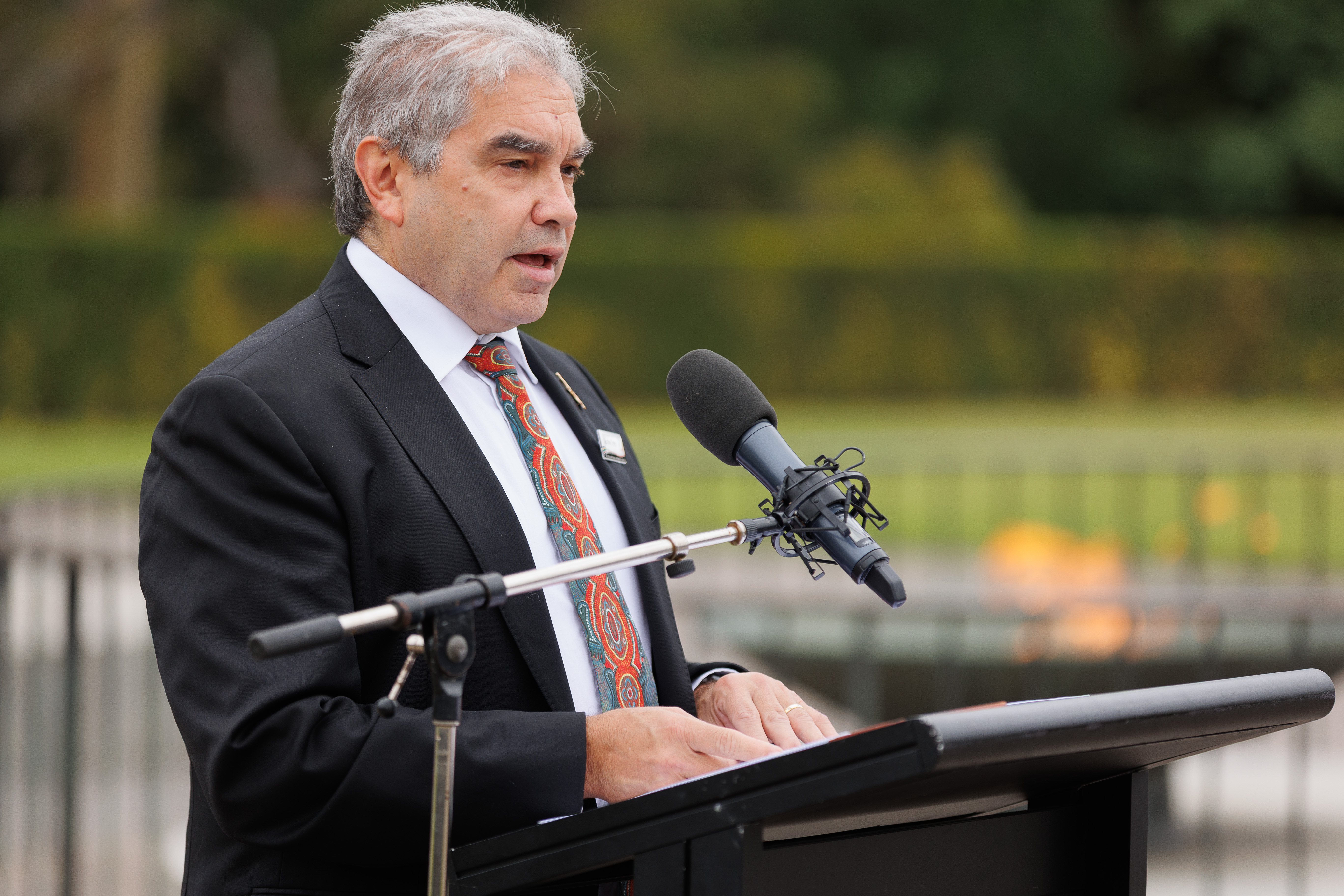 Dr Andrew Peters speaking at the Shrine of Remembrance lectern