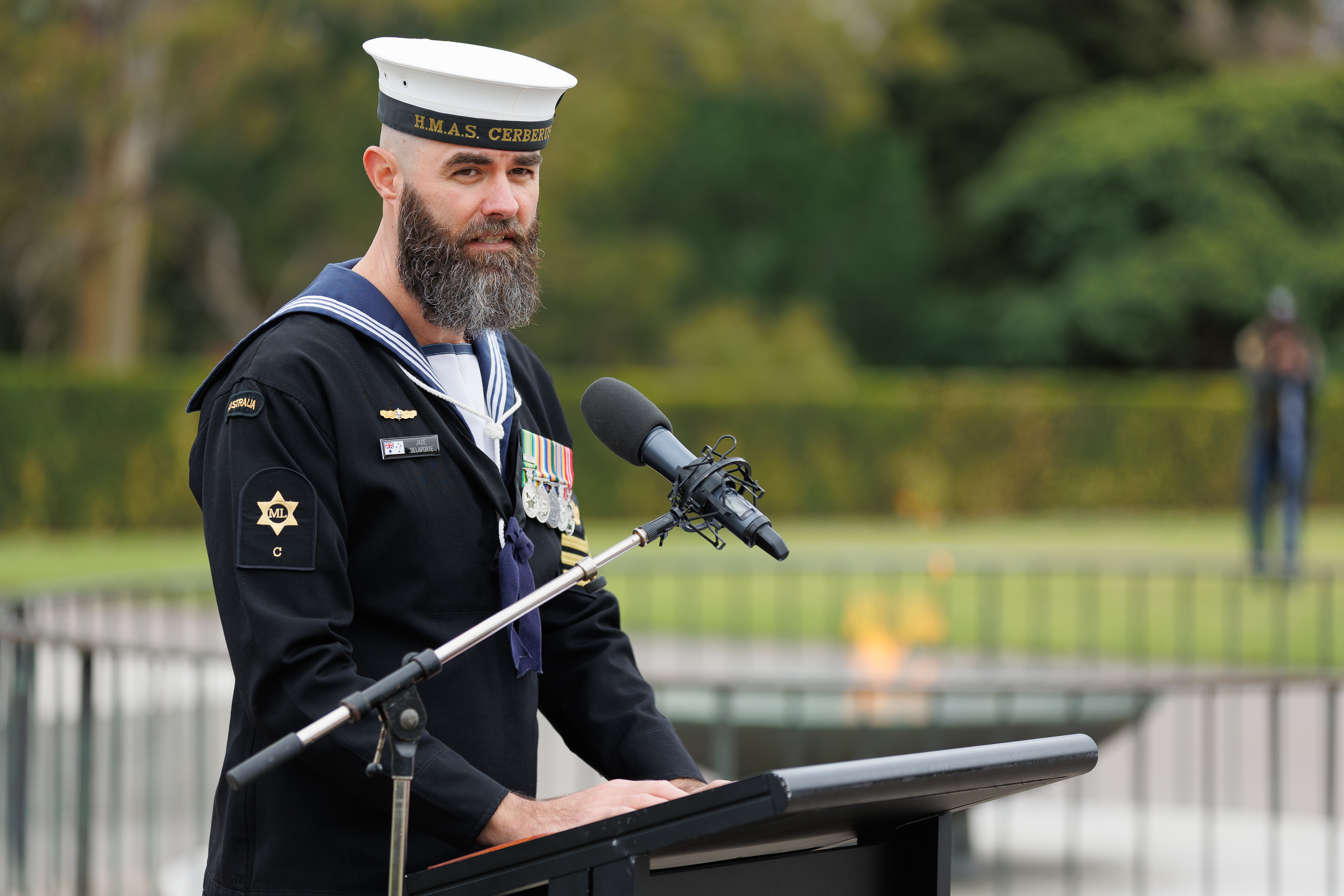 Leading Seaman Jade Delaporte speaking at the Shrine of Remembrance lectern as part of the 2025 Victorian Aboriginal Service